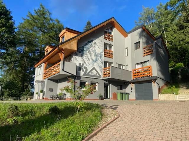 a building with a mural on the side of it at Villa K2 in Karpacz