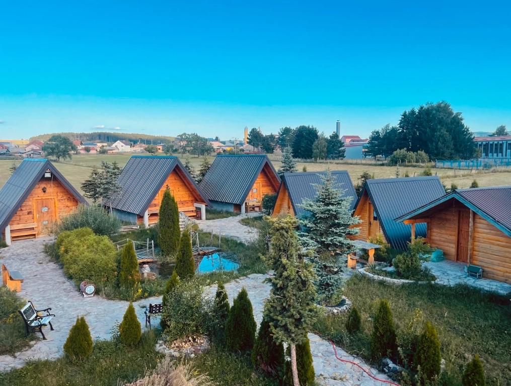 an aerial view of a log home with a pool at Smaka Brvnare in Sjenica