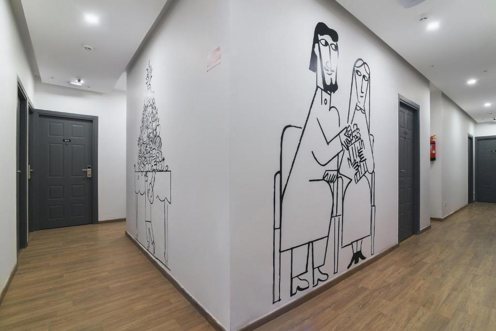 a hallway with a drawing on the wall at Townhouse Hotel Spotlight in Nawābganj