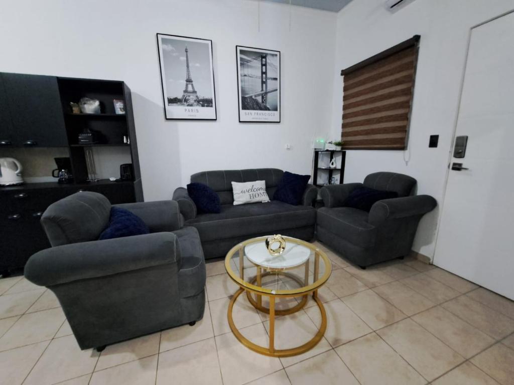 a living room with a couch and a table at The terrazzo house in Santa Ana