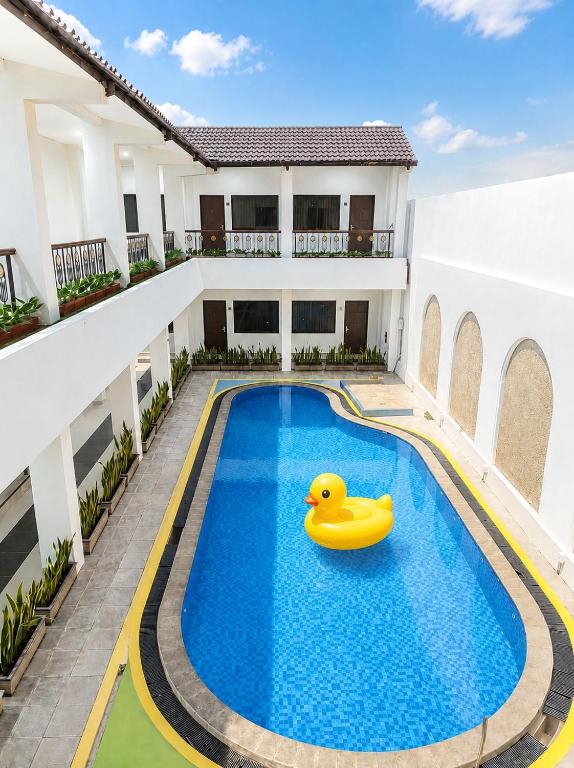 a rubber duck in the swimming pool of a house at Aisyi Tower Klaten in Klaten