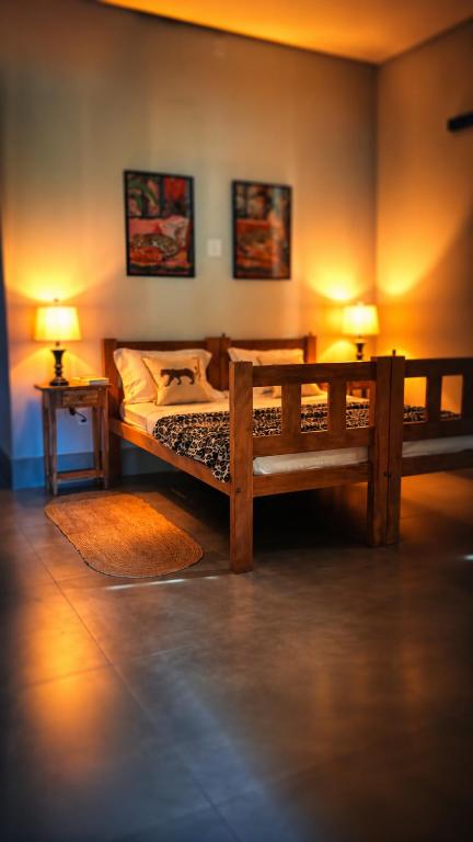 a bedroom with two bunk beds and two lamps at Pousada Veredas da Canastra in Delfinópolis