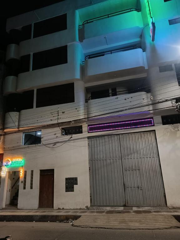 a building with two doors on the side of it at Hotel Pradera de los Celajes in Cajamarca