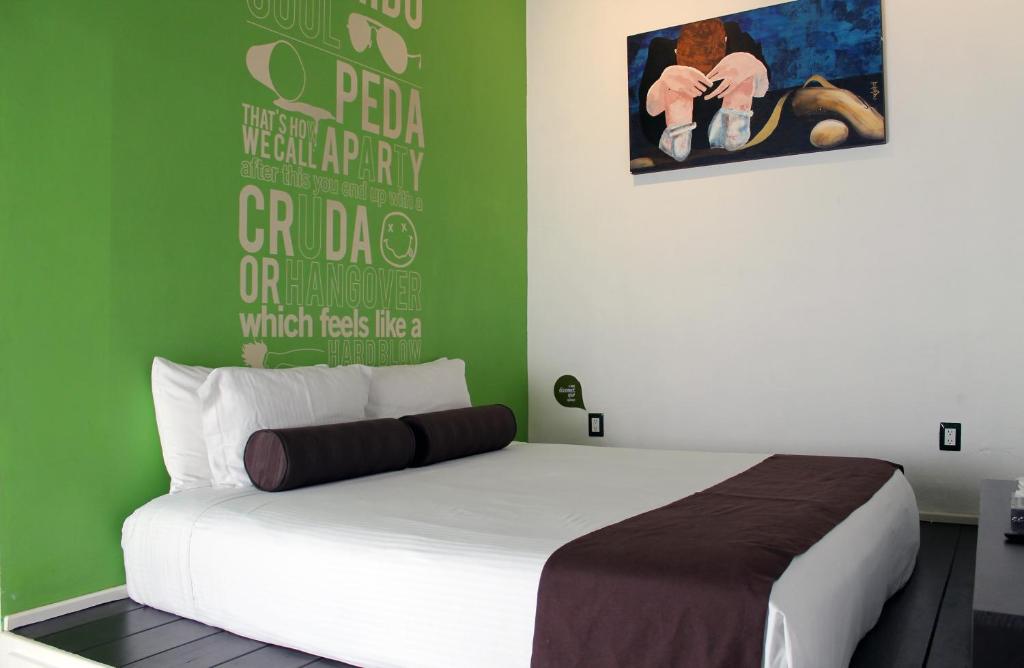 Postel nebo postele na pokoji v ubytování Kuku Ruku Hotel