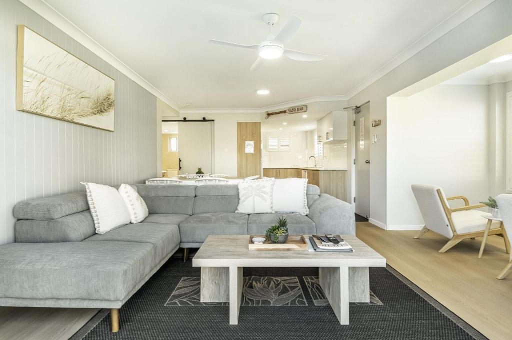 a living room with a couch and a table at Apartment 4B in Lennox Head