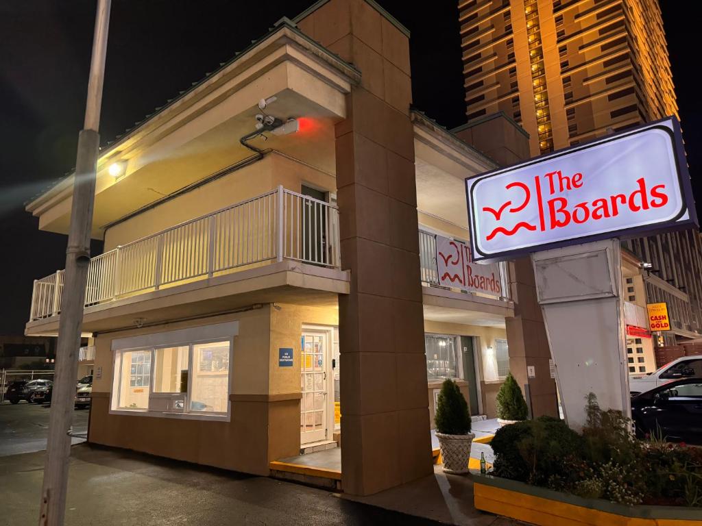 a sign in front of a building with a brands sign at The Boards AC in Atlantic City