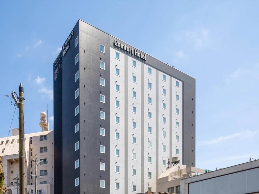 a building with a sign on top of it at Comfort Hotel ERA Ise in Ise