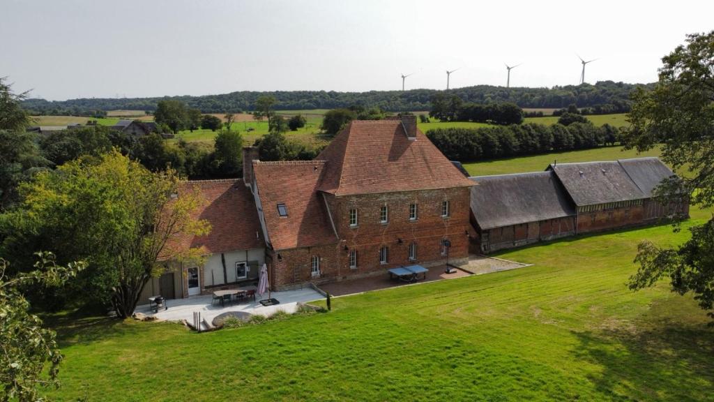 an aerial view of a large brick building at Manoir de Cottentray Charming Manor in Avesnes-en-Bray