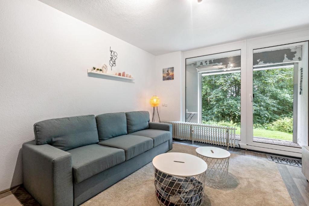 a living room with a couch and a table at Apartment Maja in Winterberg