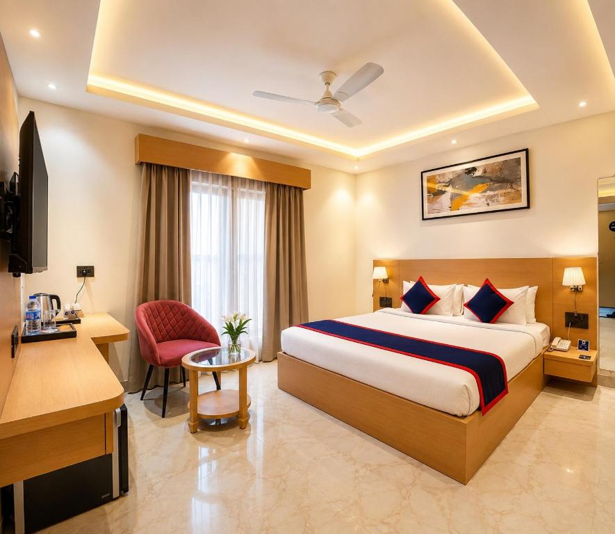 a hotel room with a bed and a desk at Zip by Spree Hotels R Group Kota - Near Coaching Hub & Oxy Park in Kota