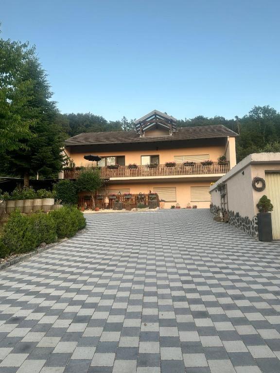 a house with a large driveway in front of it at Ferienwohnung Lavendel in Ühlingen-Birkendorf