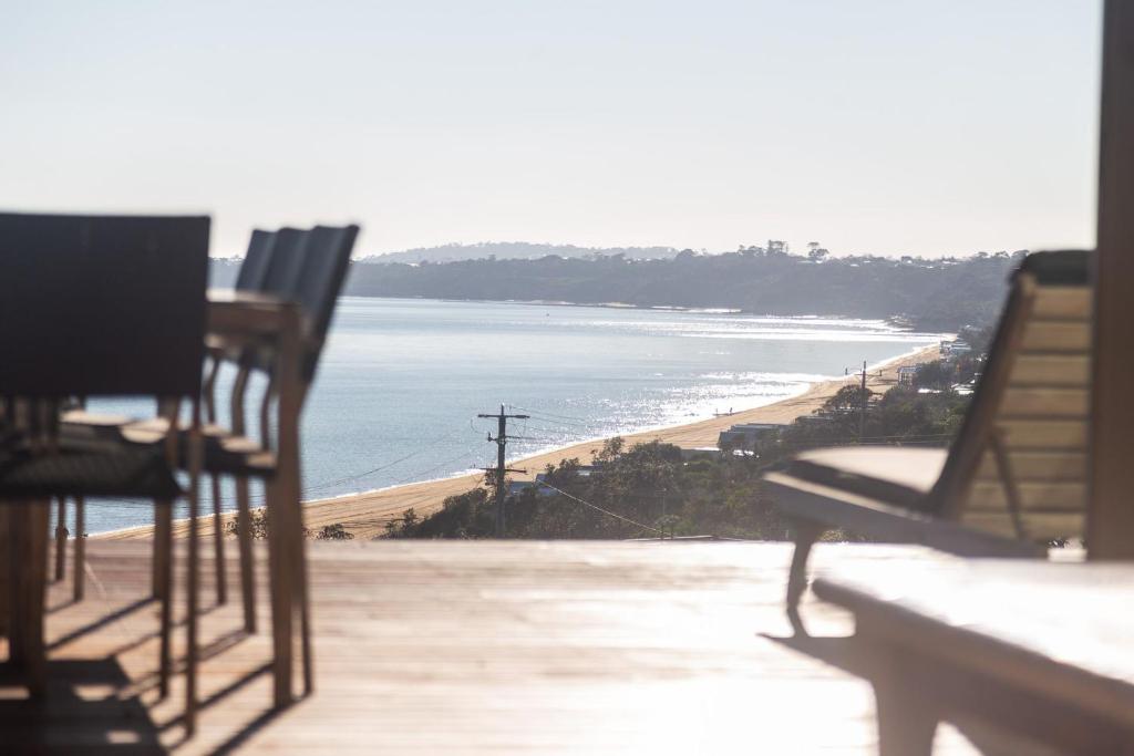 a view of the beach from a balcony at Emanjay - Mineral Spa, Million Dollar Views in Mount Martha