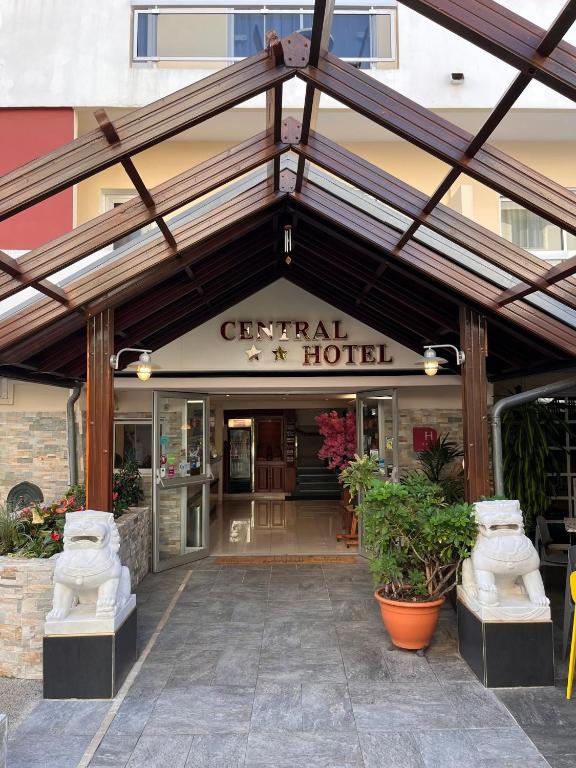 an entrance to a hotel with a building at Central Hotel in Saint-Denis