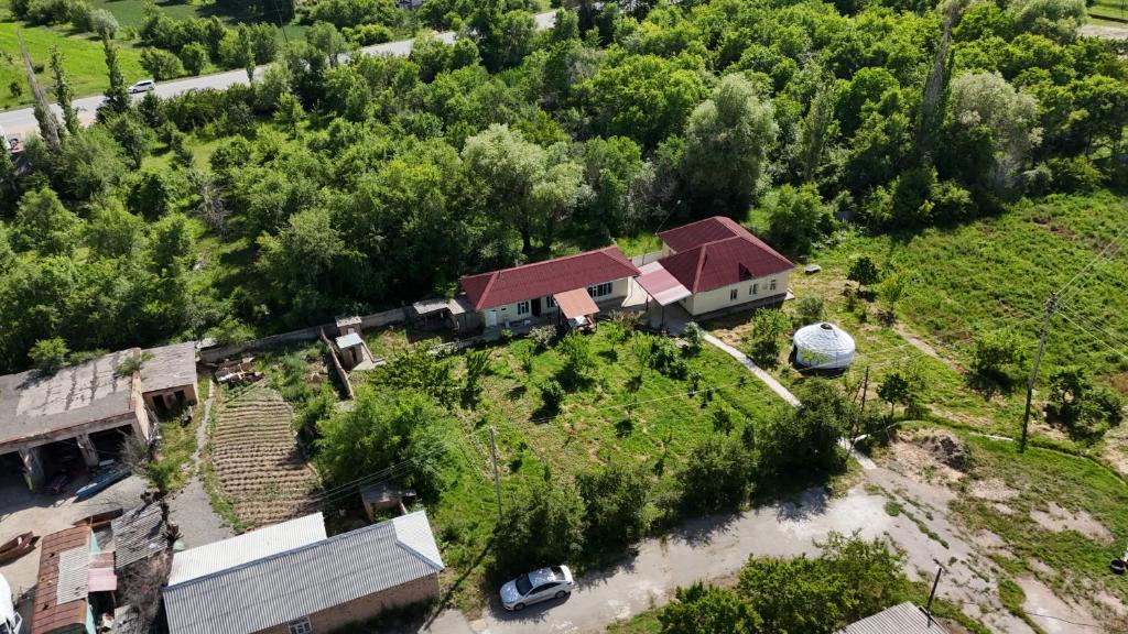an aerial view of a house with a yard at ASAN ATA Guest House in Toktogul