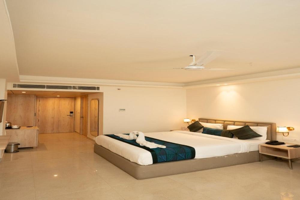 a bedroom with a large bed in a room at Tirupati Resorts in Kota