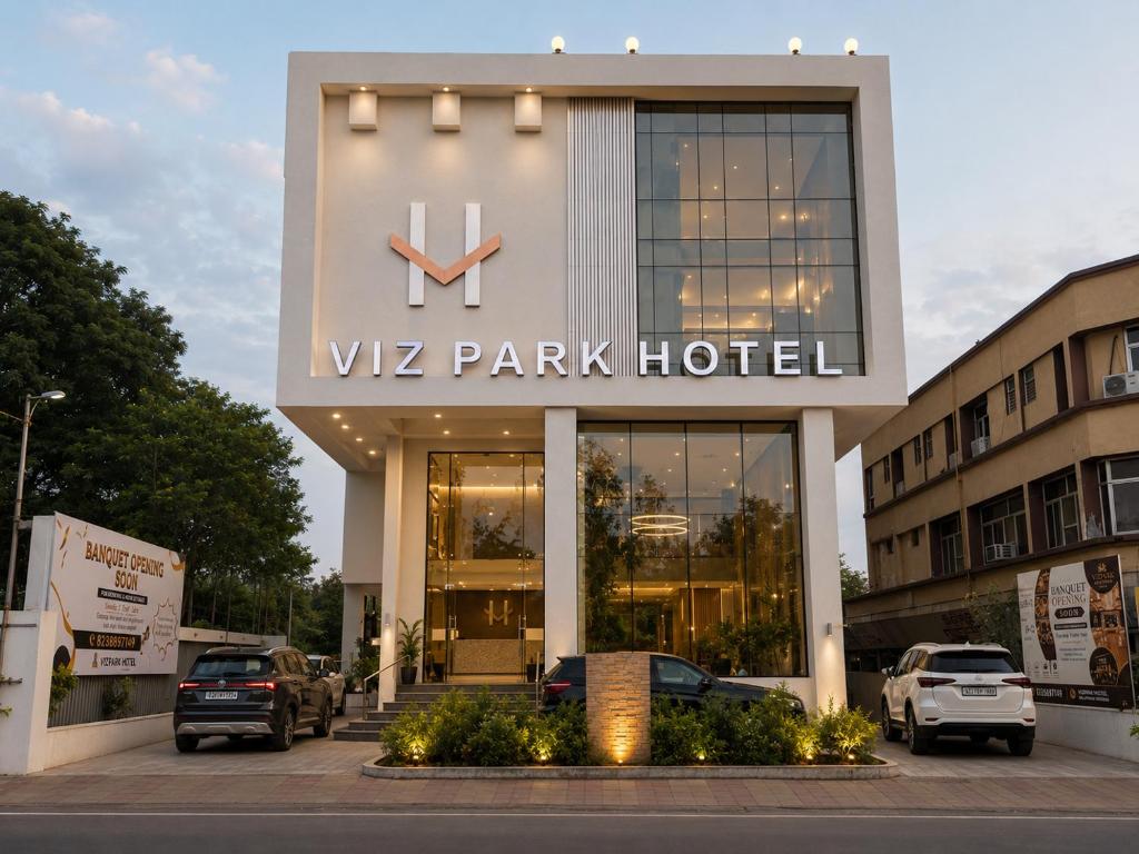 a wz park hotel with cars parked outside of it at Viz Park Hotel - Business Hotel & Banquet, GIDC Anand in Anand
