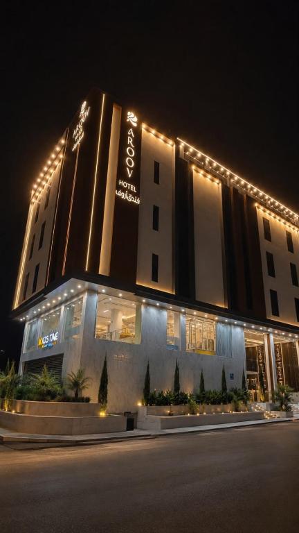 a building with lights on top of it at night at فندق أروف Aroov Hotel in Taif