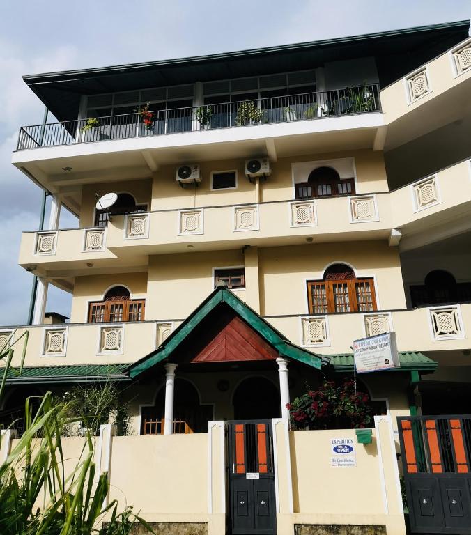 a large building with a balcony on top of it at Expeditor Kandy in Kandy