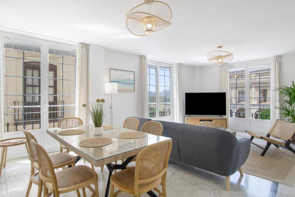 a living room with a table and a couch at Martin De Aldehuela Apartment in Ronda