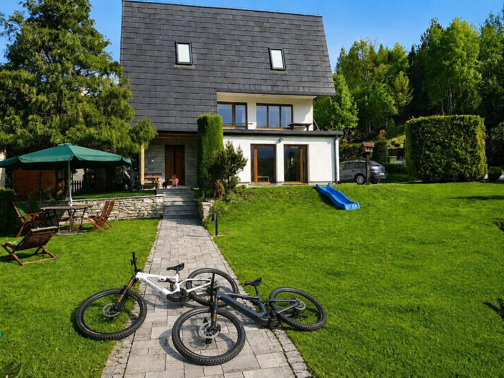 a couple of bikes parked in front of a house at Dom Wakacyjny Brenna in Brenna