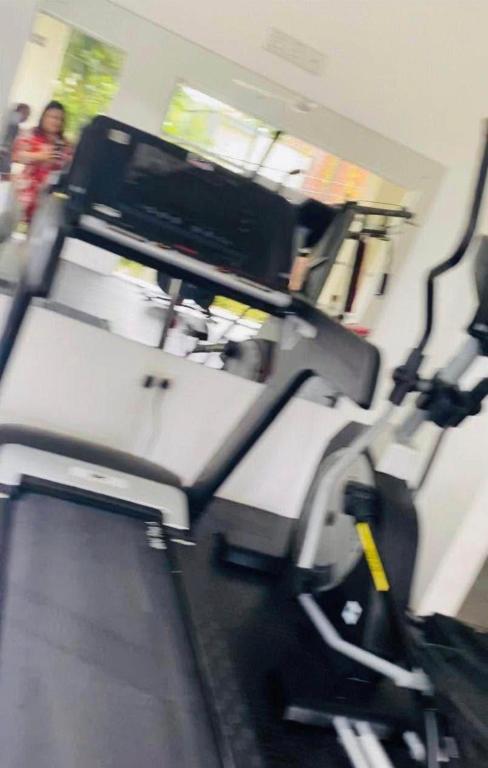 a room with a gym with a treadmill at Prime Lake Villa in Kundasale