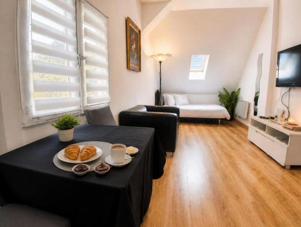 a living room with a table with food on it at Haven Sierentz in Sierentz
