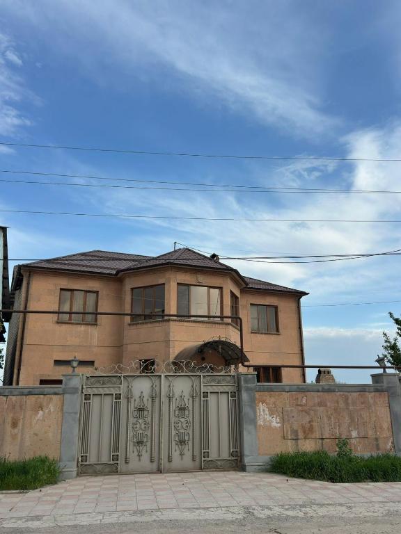 a house with a gate in front of it at Dom in Aygavan