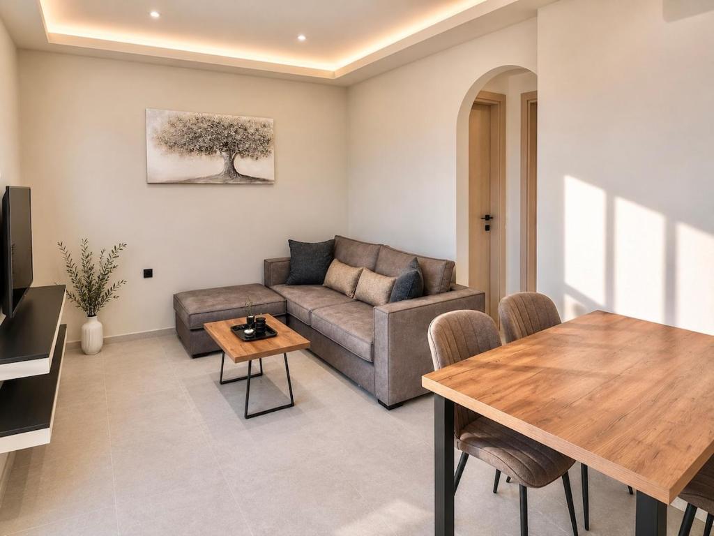 a living room with a couch and a table at Amara 2 bedrooms apartment - Alykanas in Alikanas