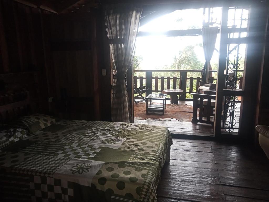 a bedroom with a bed and a view of a balcony at Paz y Tranquilidad in Marsella