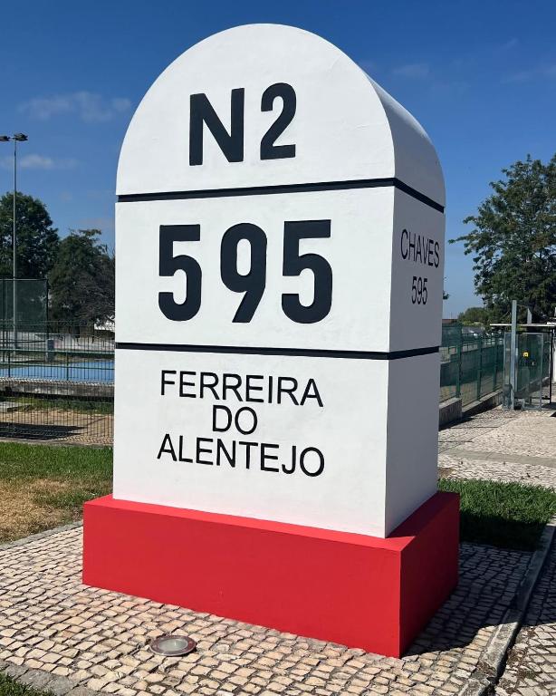 a sign that is on the side of a street at Casa da Avó Caia in Ferreira do Alentejo