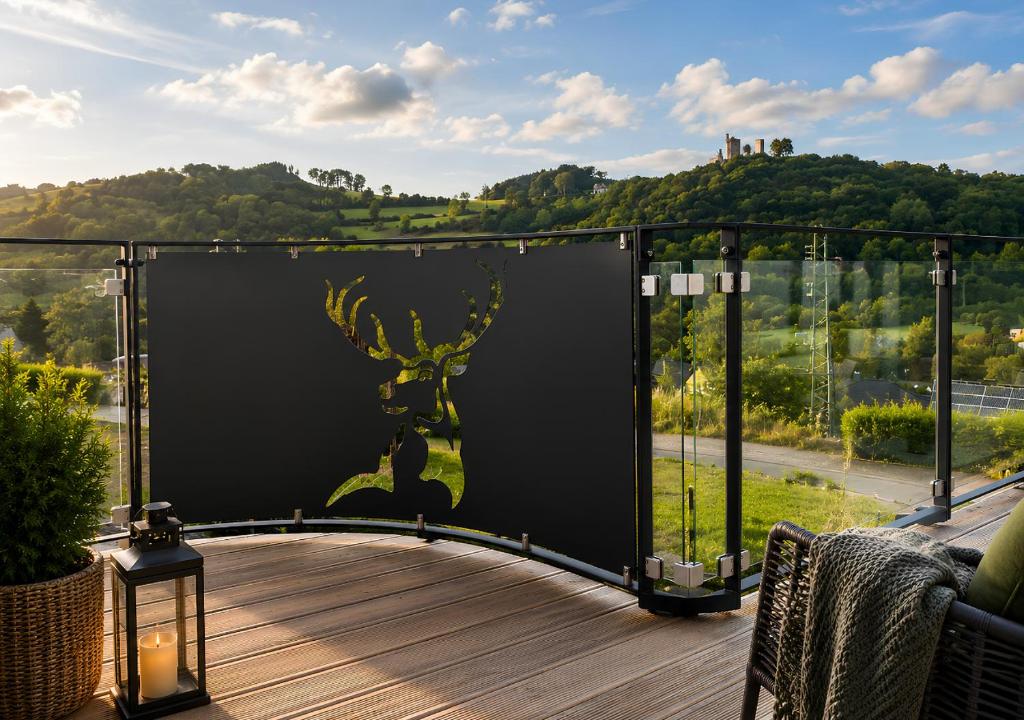 a deck with a view of a mountain at Appartement - Eifelglück in Pelm