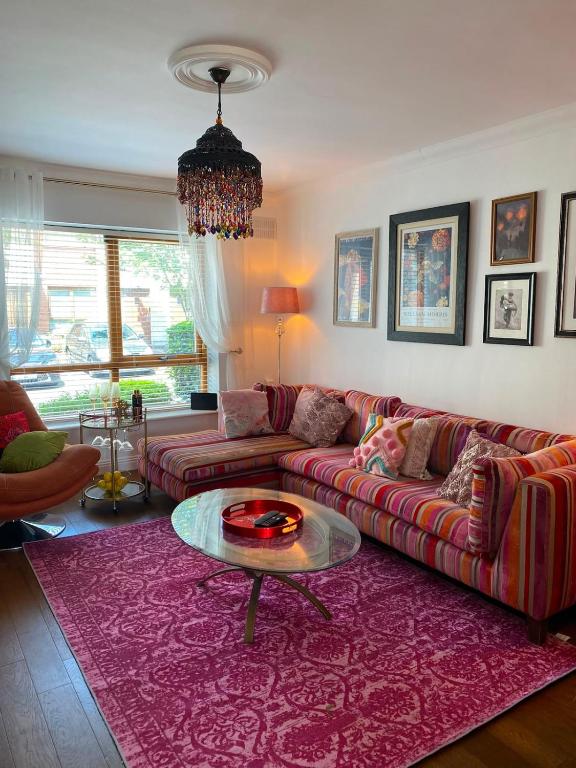 a living room with a couch and a table at Dunboyne Apartment in Dunboyne