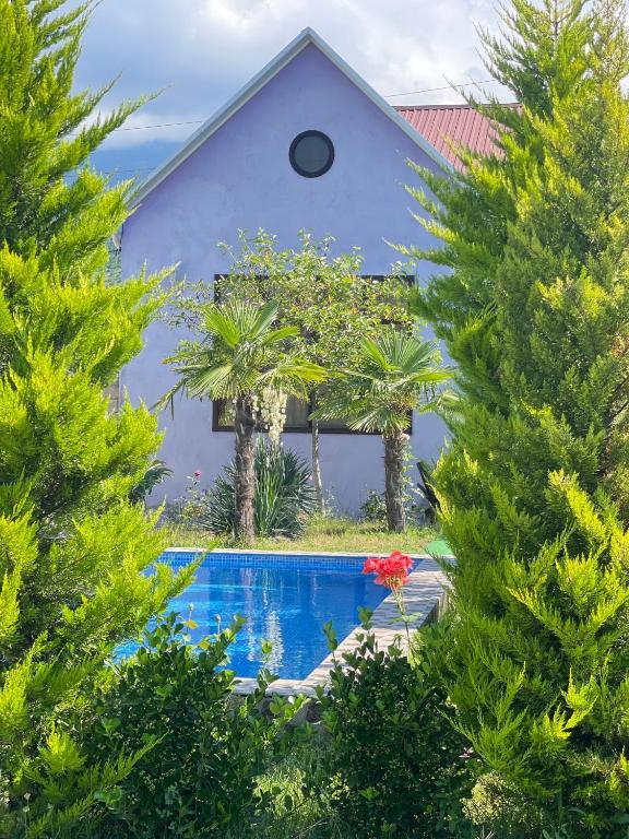 a house with a swimming pool in the yard at AkbA-Frame3 in İsmayıllı