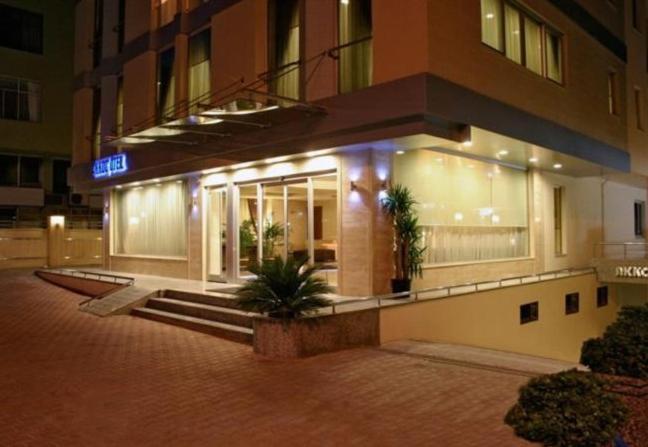 a building at night with a sign on it at Akkoç Butik Otel in Seyhan