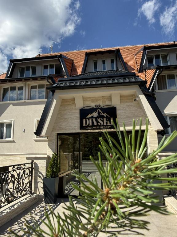 a building with a sign that reads dixlash at Divski Resort in Divčibare