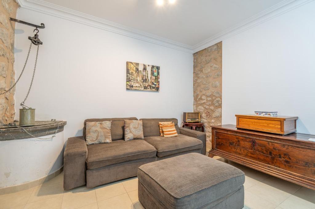 a living room with a couch and a table at Casa Nord in El Port de la Selva