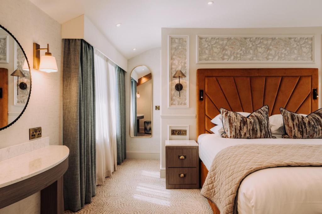 a hotel room with a bed and a sink at Skiddaw Hotel in Keswick