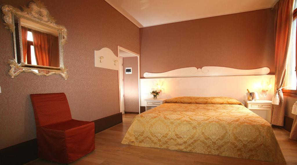 Postel nebo postele na pokoji v ubytování Hotel Corte dei Greci