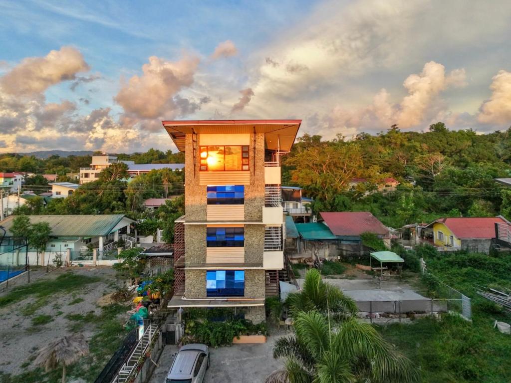 an overhead view of a building with blue windows at Sea Break La Union in Balio