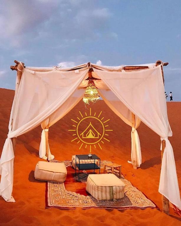 a tent in the middle of the desert at Shining Luxury Camp in Merzouga