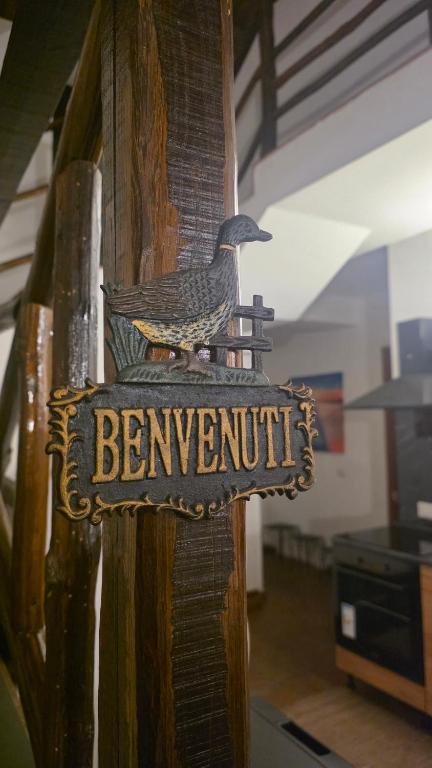 a sign with a bird on the side of a building at La Dimora del Grifo in Mascalucia