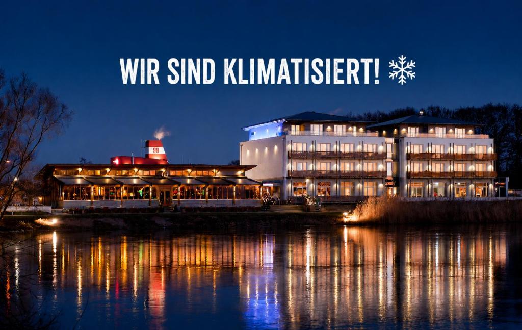 a building with a sign that reads wvr blind kimmitert at night at Riverside Hotel in Nordhorn