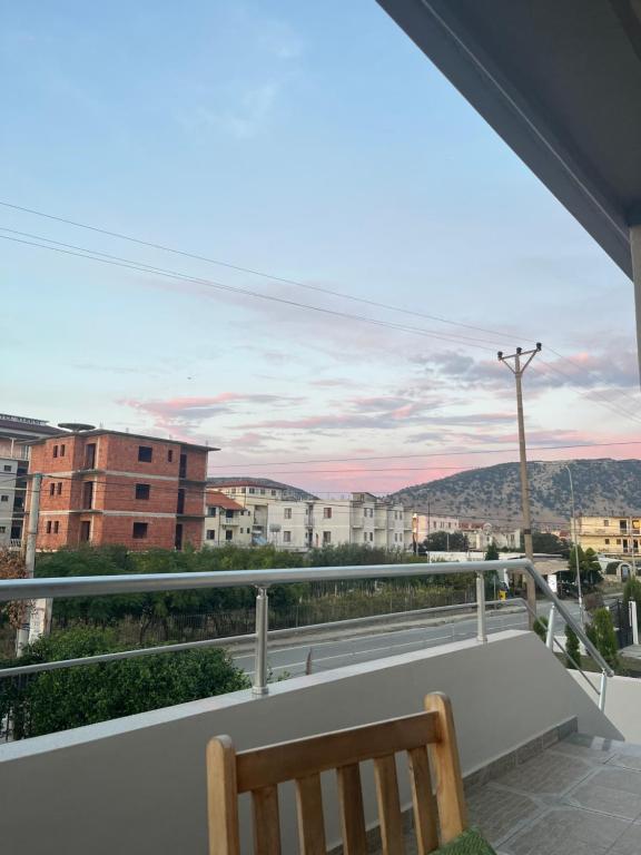 a balcony with a bench and a view of a city at Villa Keti in Velipojë