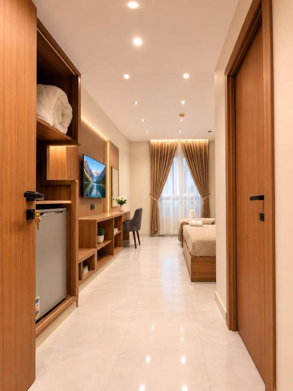 a hotel room with a bed and a desk at ReLax havanaa in Cairo