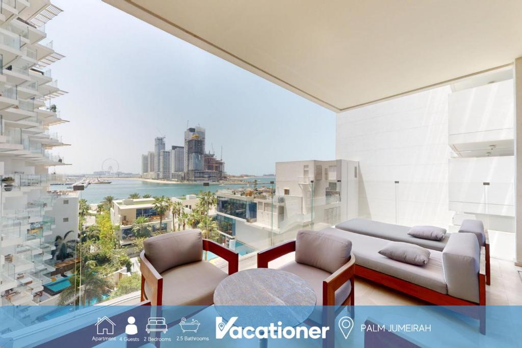 a living room with a view of the city at Vacationer Holiday Homes I Opulent 2 Bedroom I Sea View I Beach Access l FIVE Palm in Dubai