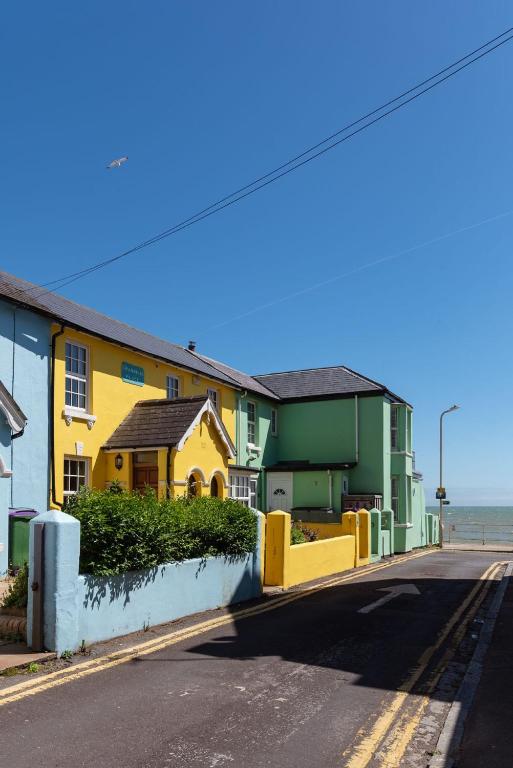 a row of houses on the side of a street at Sea View Cottage, Sandgate in Sandgate