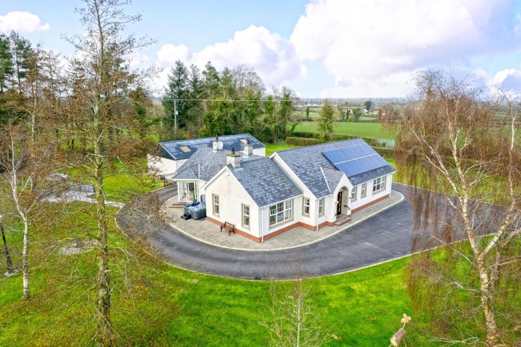 an aerial view of a house with solar panels on it at Turner's Corner by Escape Ordinary in Aghadowey