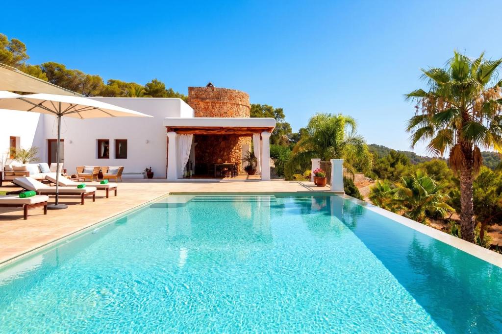 a swimming pool in front of a villa at New! Villa Llosas de Dalt in Sant Carles de Peralta