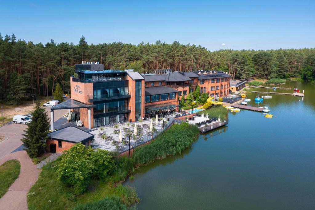 an aerial view of a resort on a lake at Hotel Duo Spa in Janów Lubelski