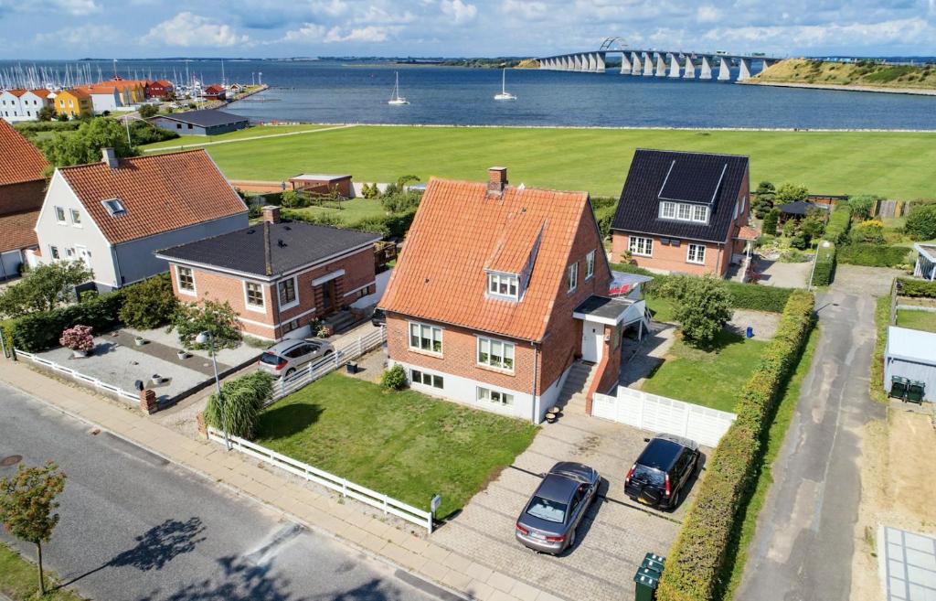 an aerial view of a house with cars parked in front at SeaviewHouse Rudkøbing in Rudkøbing
